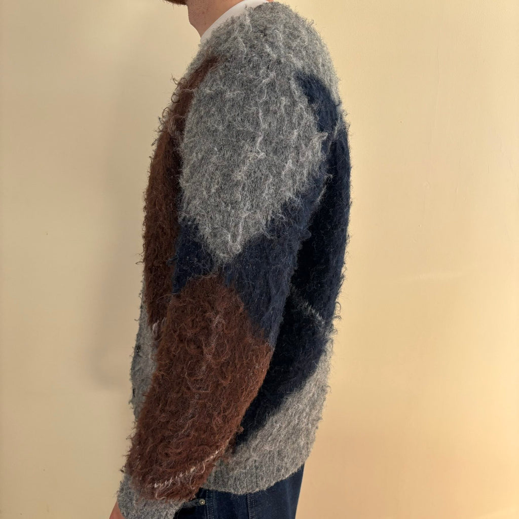 Vintage 70s knitted cardigan grey base with navy and brown oversized argyle pattern.