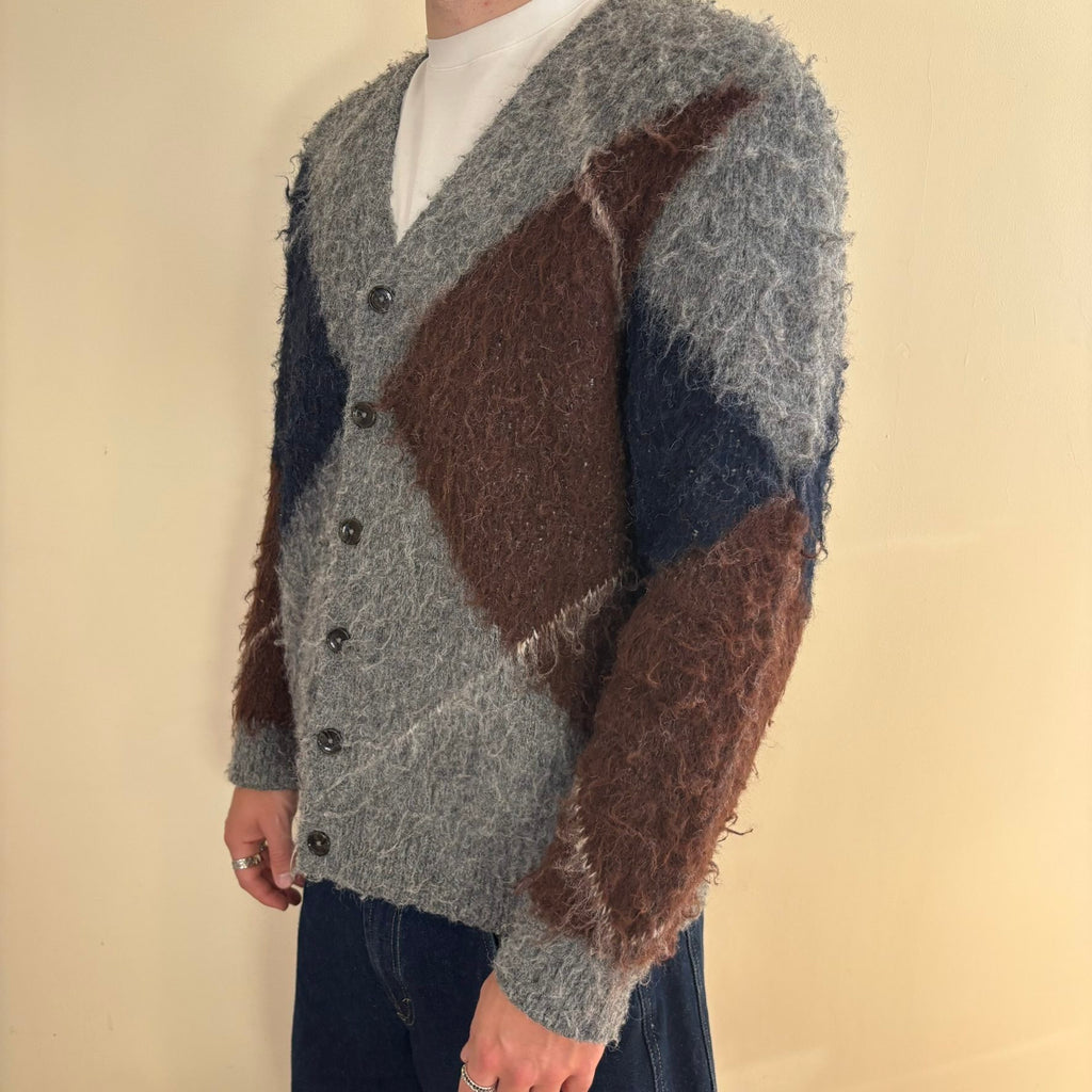 Vintage 70s knitted cardigan grey base with navy and brown oversized argyle pattern.