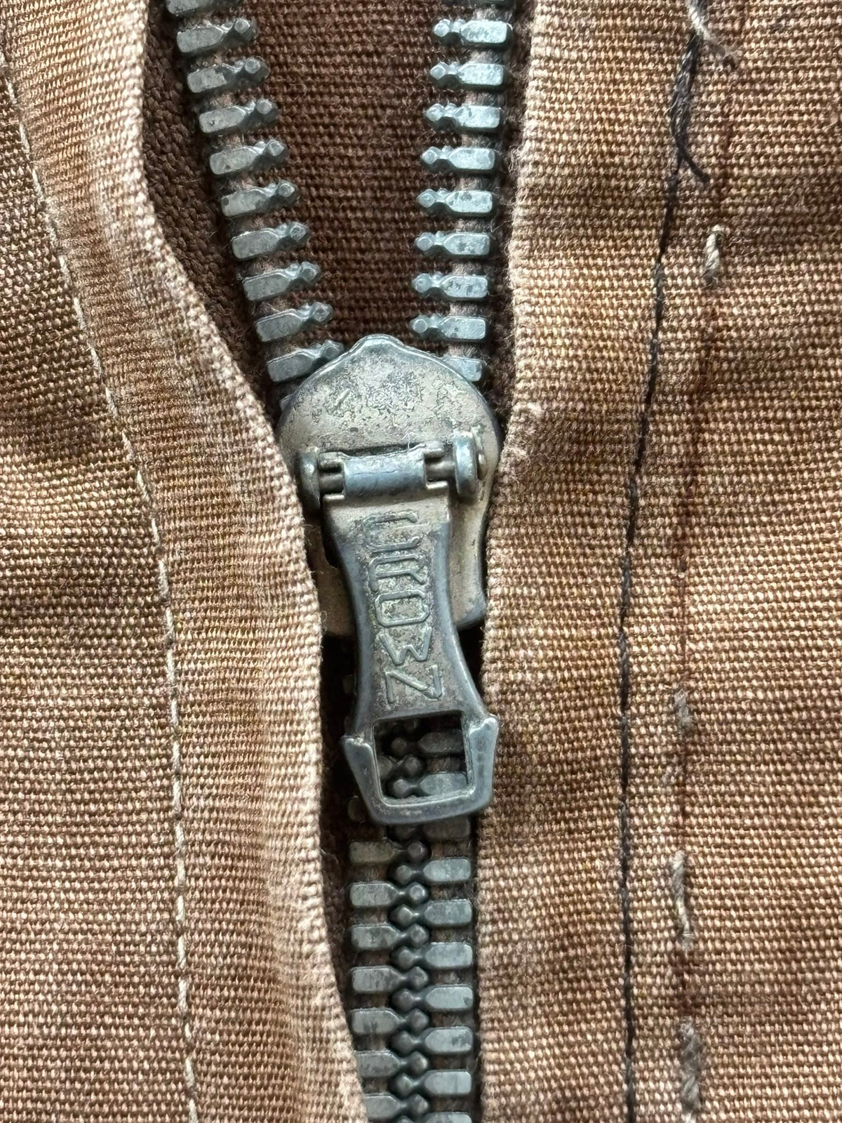 Vintage brown cropped work jacket with pointed collar and CROWN zipper pull.