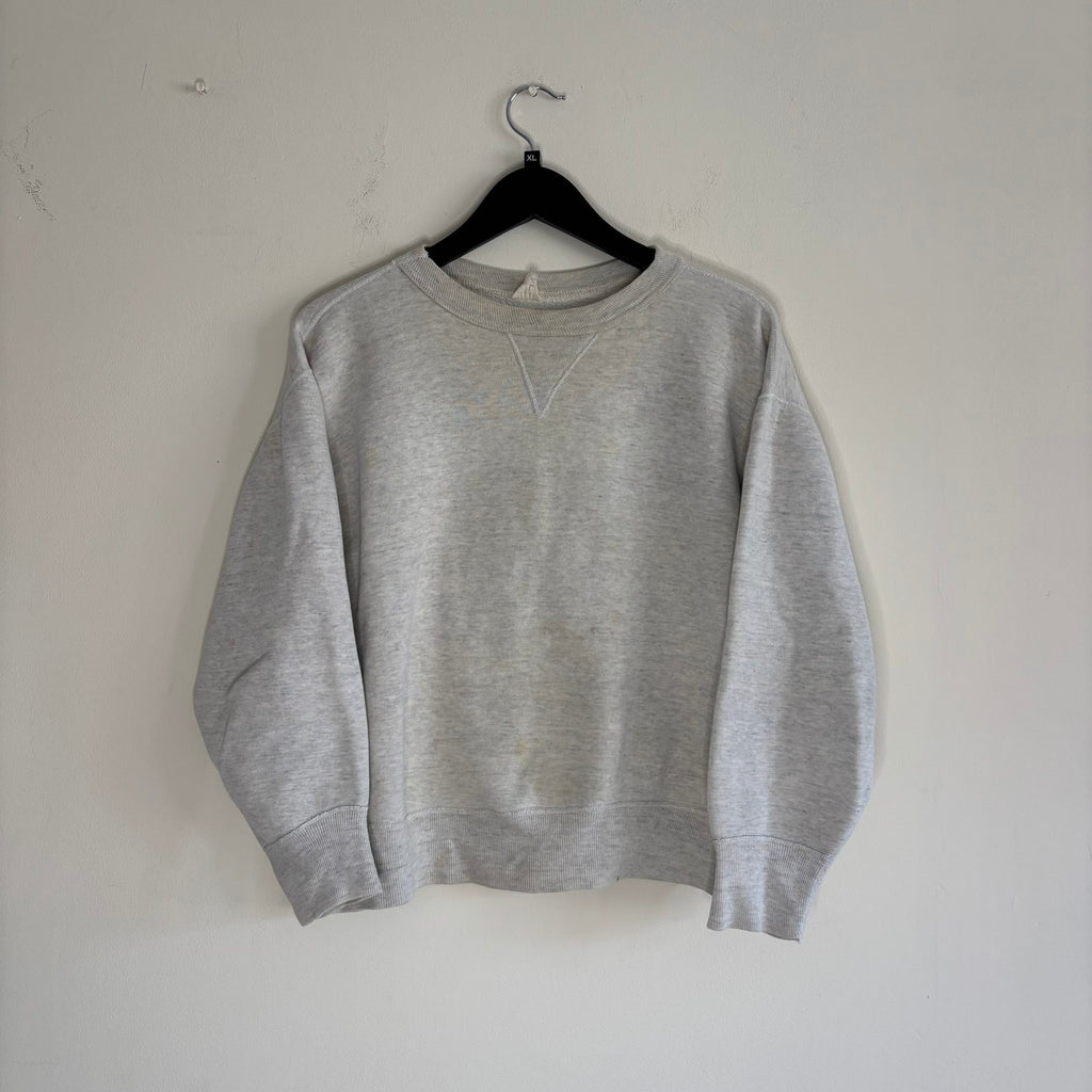 Russell Athletic grey crewneck sweatshirt with single V neck, ribbed details, and vintage tag.