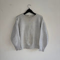 Russell Athletic grey crewneck sweatshirt with single V neck, ribbed details, and vintage tag.