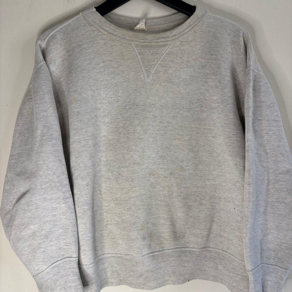 Russell Athletic grey crewneck sweatshirt with single V neck, ribbed details, and vintage tag.