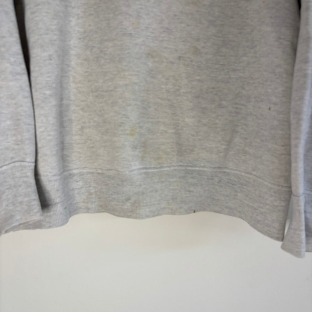 Russell Athletic grey crewneck sweatshirt with single V neck, ribbed details, and vintage tag.