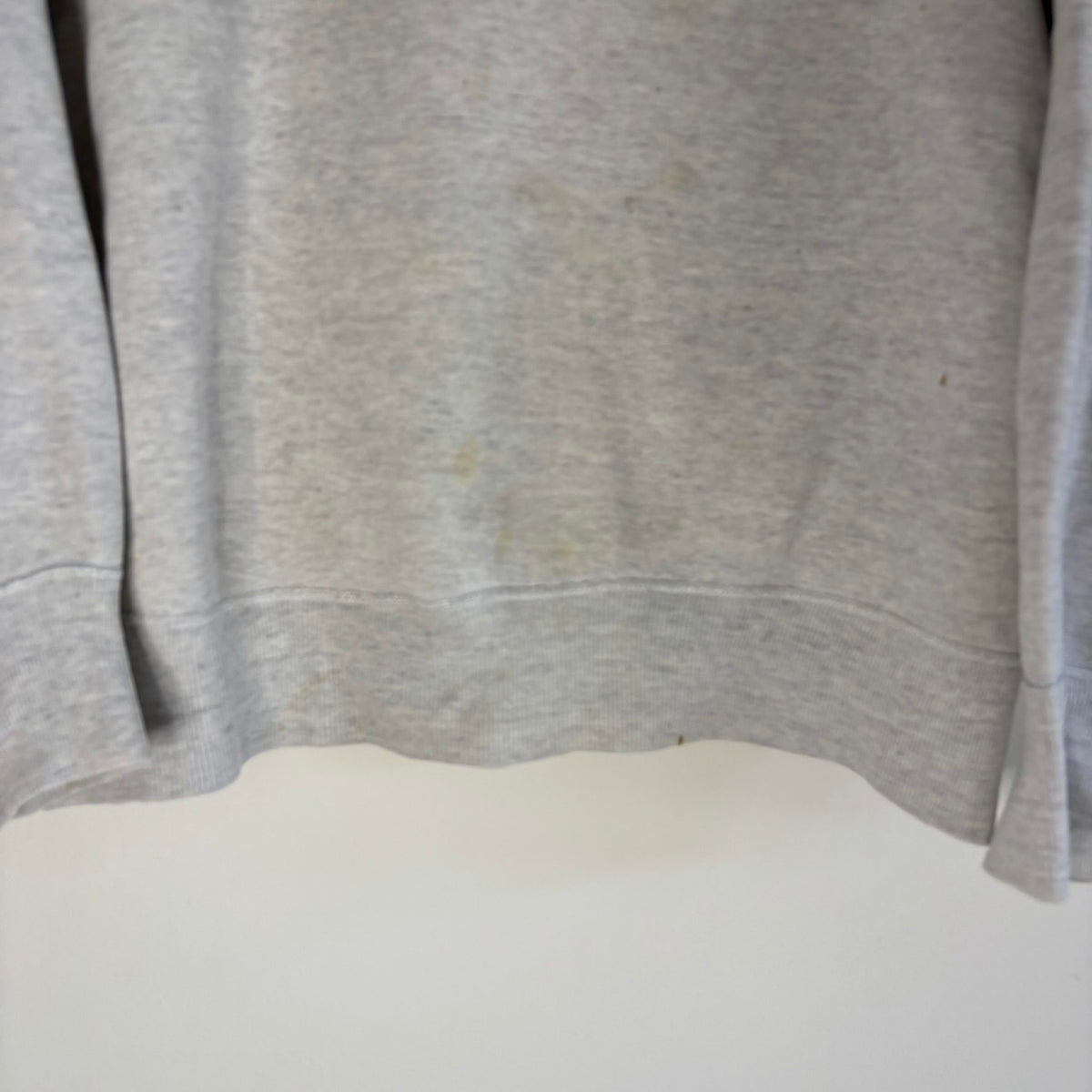 Russell Athletic grey crewneck sweatshirt with single V neck, ribbed details, and vintage tag.