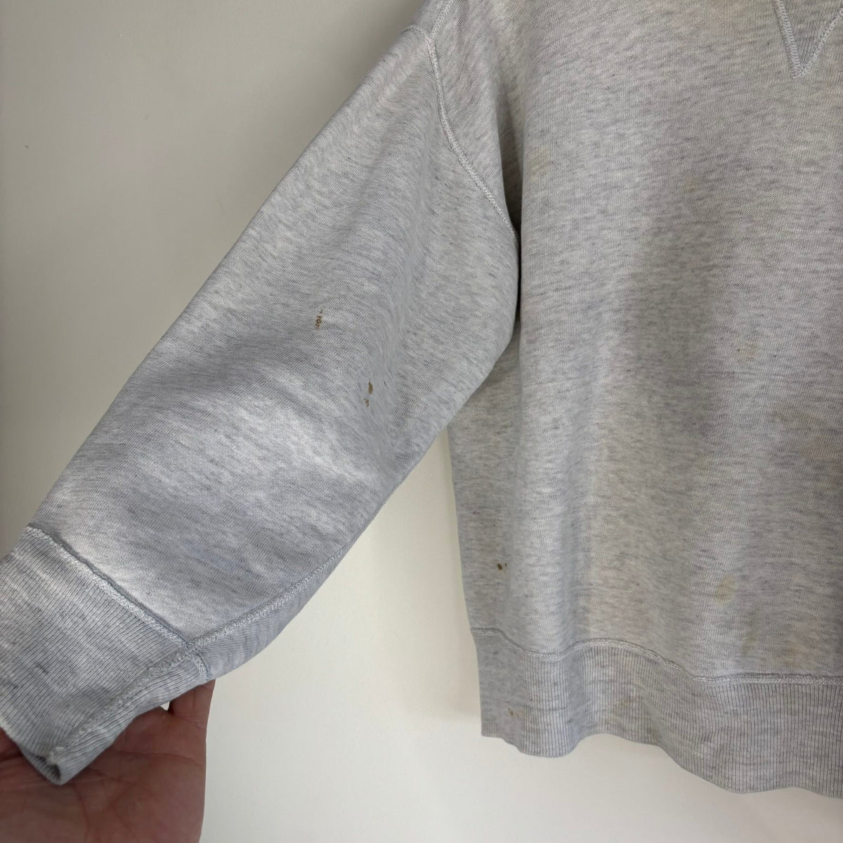Russell Athletic grey crewneck sweatshirt with single V neck, ribbed details, and vintage tag.