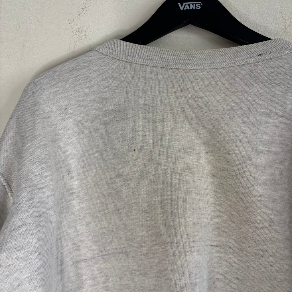 Russell Athletic grey crewneck sweatshirt with single V neck, ribbed details, and vintage tag.